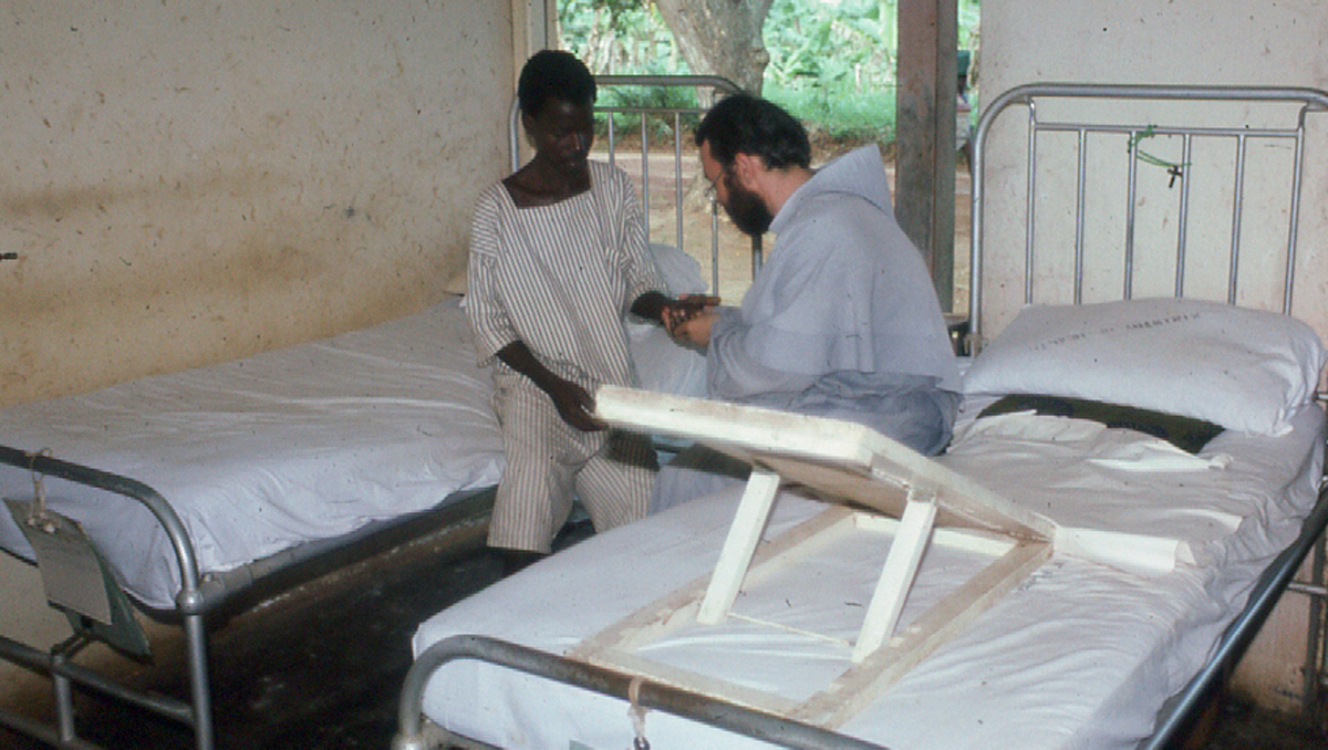 Br. Vincent caring for boy with leprosy